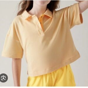 Athleta Girl Retrochill cropped Yellow Polo Shirt. NWT. Size medium 8 - 10